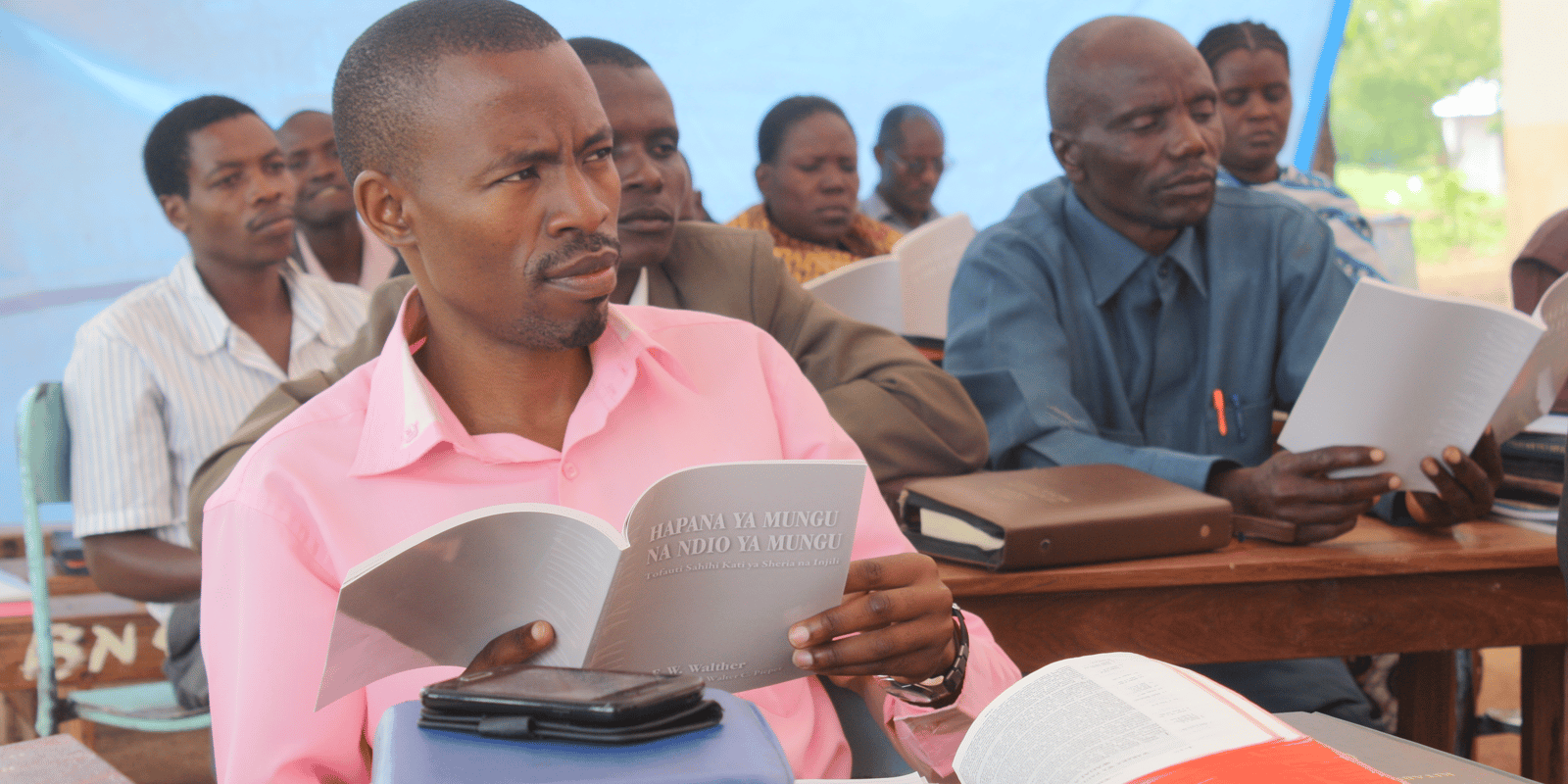Tanzania Pastor With Luther's Small Catechism