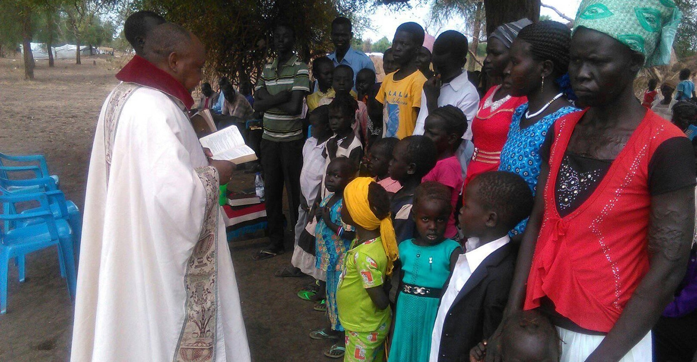 Peter Abia preaching to children