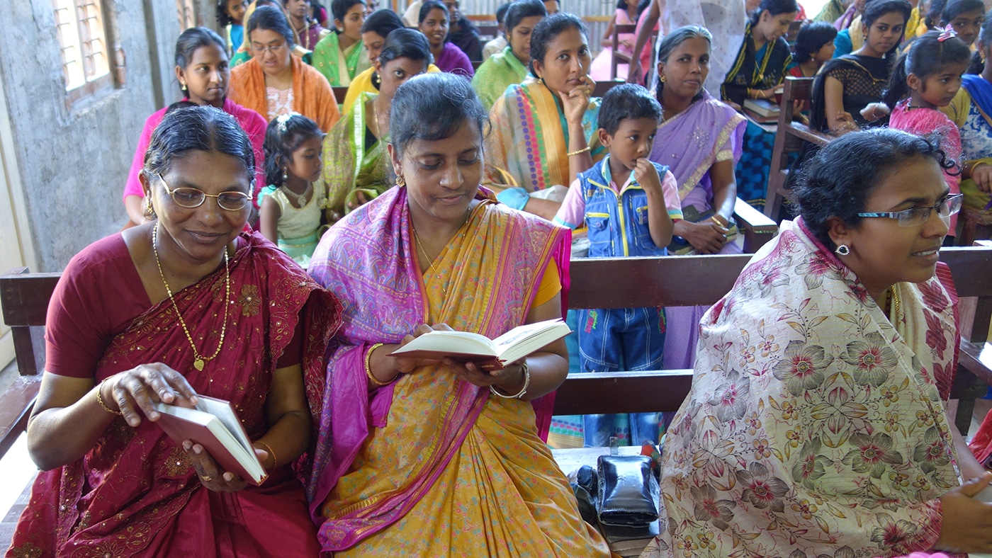 Indian women reading Luther's Small Catechism