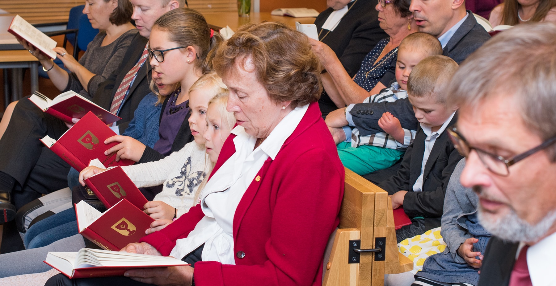 Finland People Singing From Hymnals
