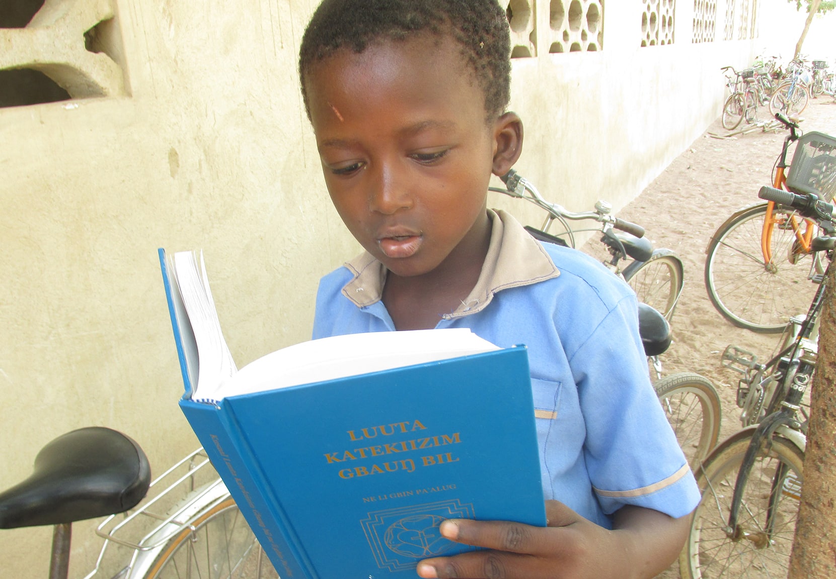 Ghana Boy Reading Catechism