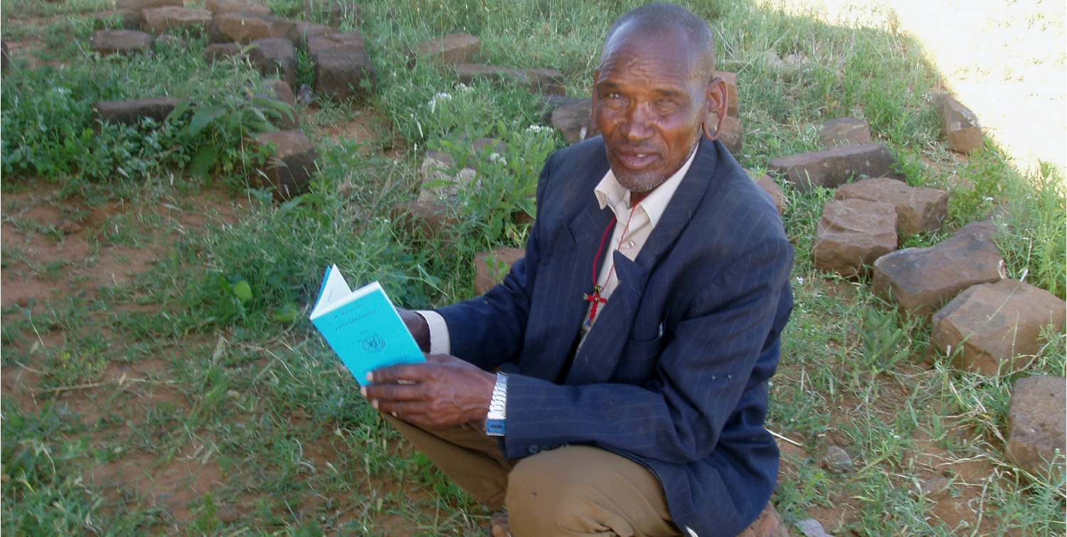 Masaai Man Reading Luther's Small Catechism