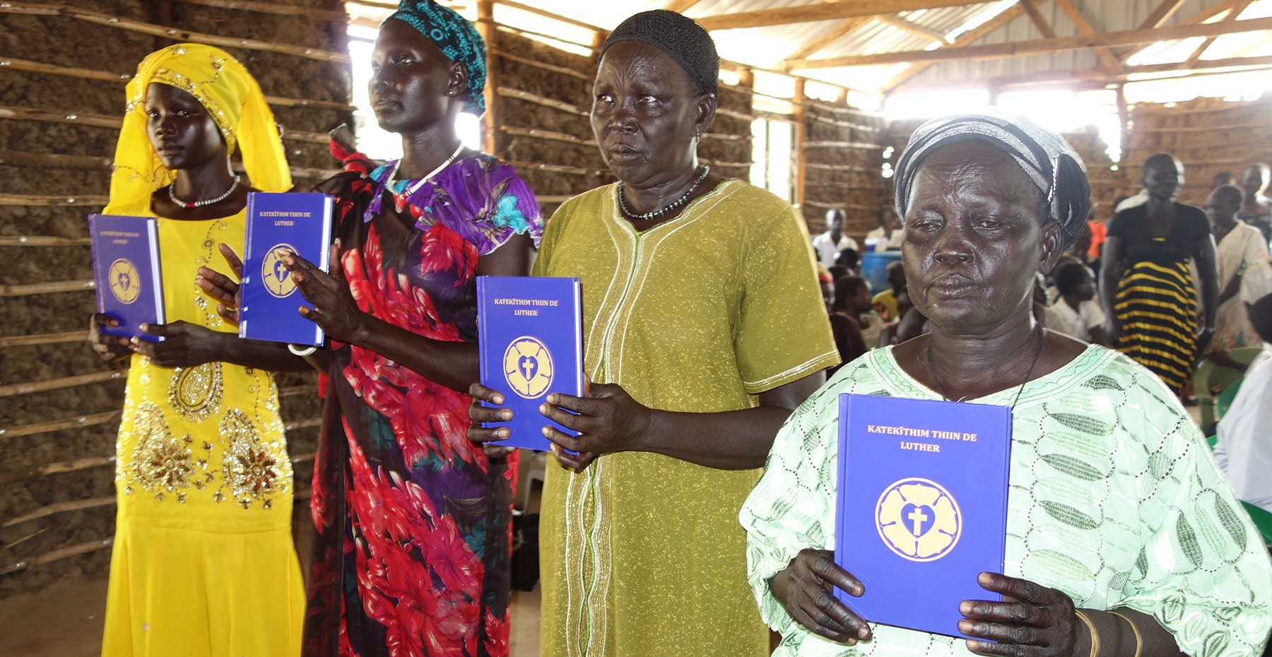 Sudan Dinka Women Holding Luther's Small Catechisms