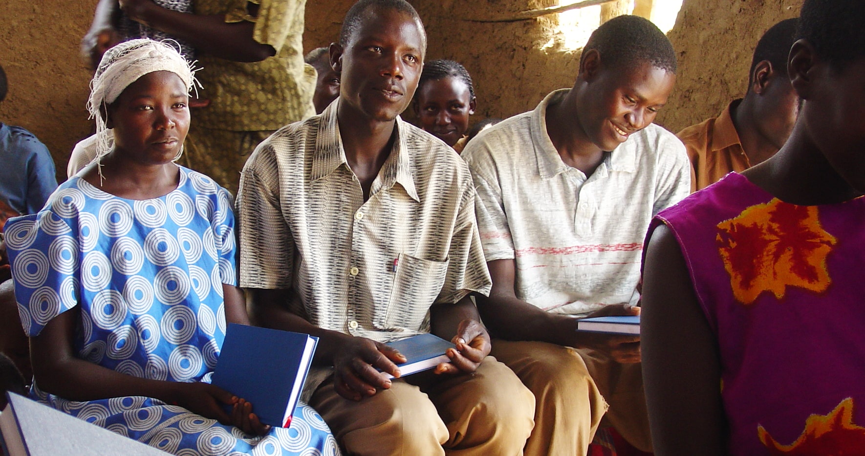 Uganda Couple Holding Luther's Small Catechism