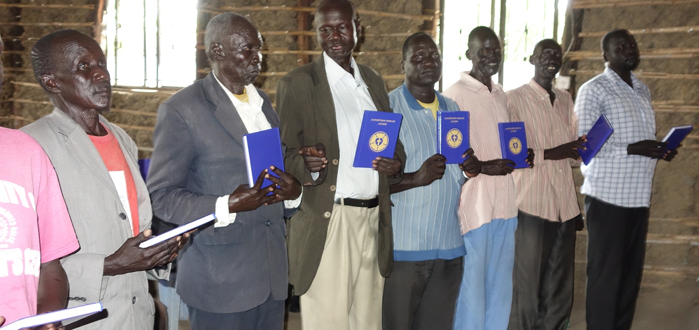 Banner Sudan Men Receiving Luther's Small Catechism