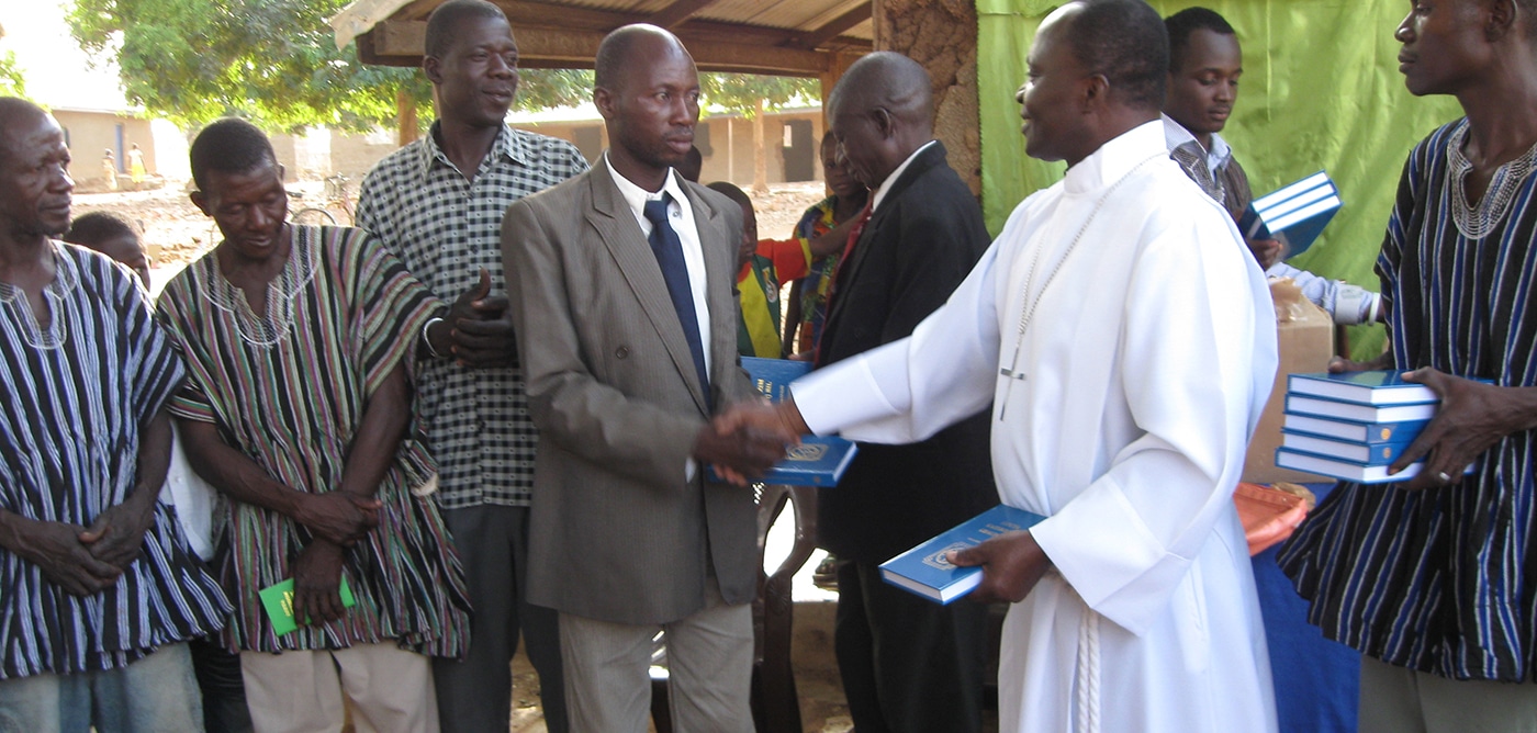 Ghana Nicholas Salifu Distributing Luther's Small Catechisms