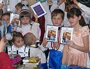 Ukrainian Children holding 100 Bible Stories
