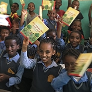 African children holding A Child's Garden of Bible Stories