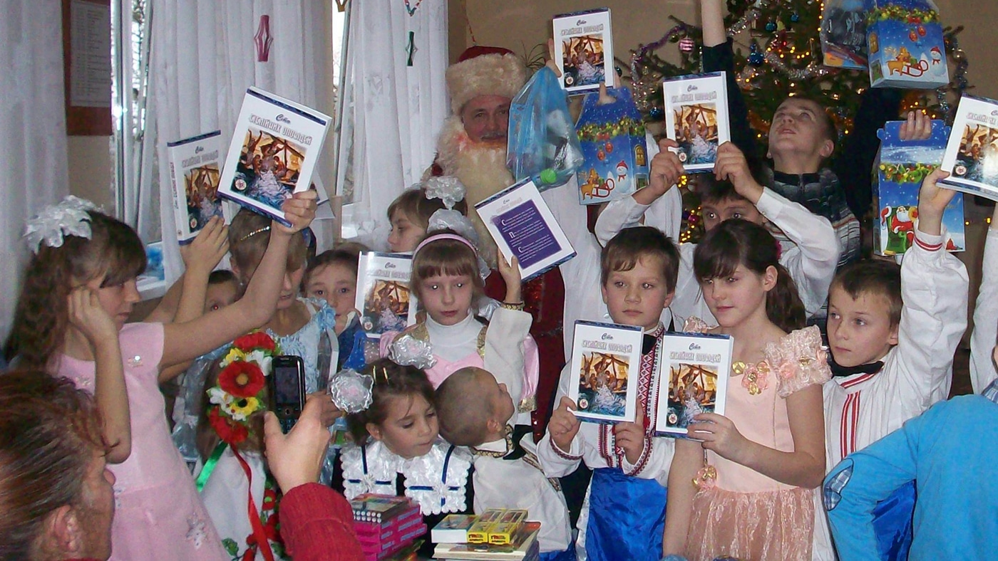 Ukrainian Children holding 100 Bible Stories