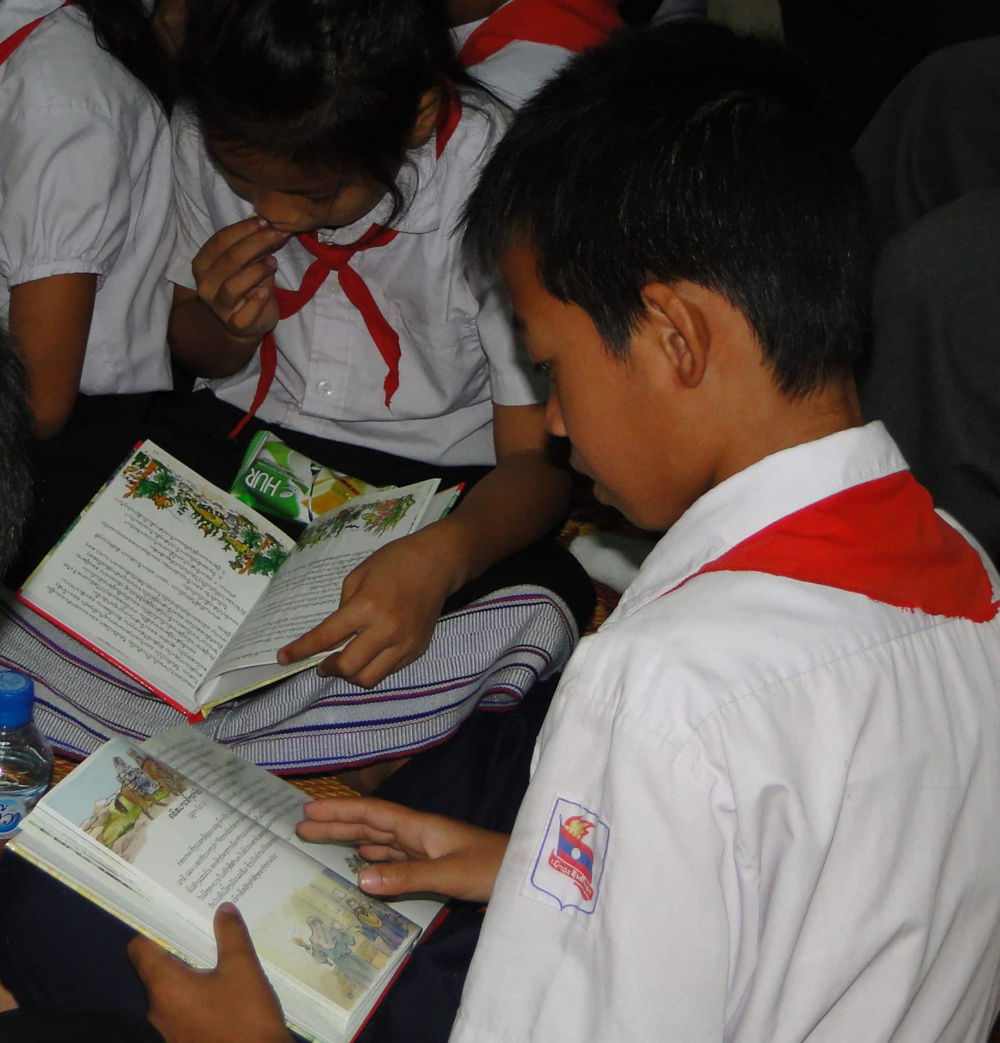 Lao Boy Reading A Child's Garden of Bible Stories