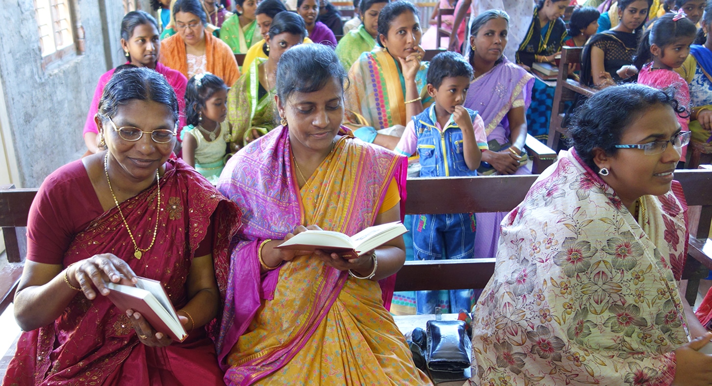 Indian women reading Luther's Small Catechism