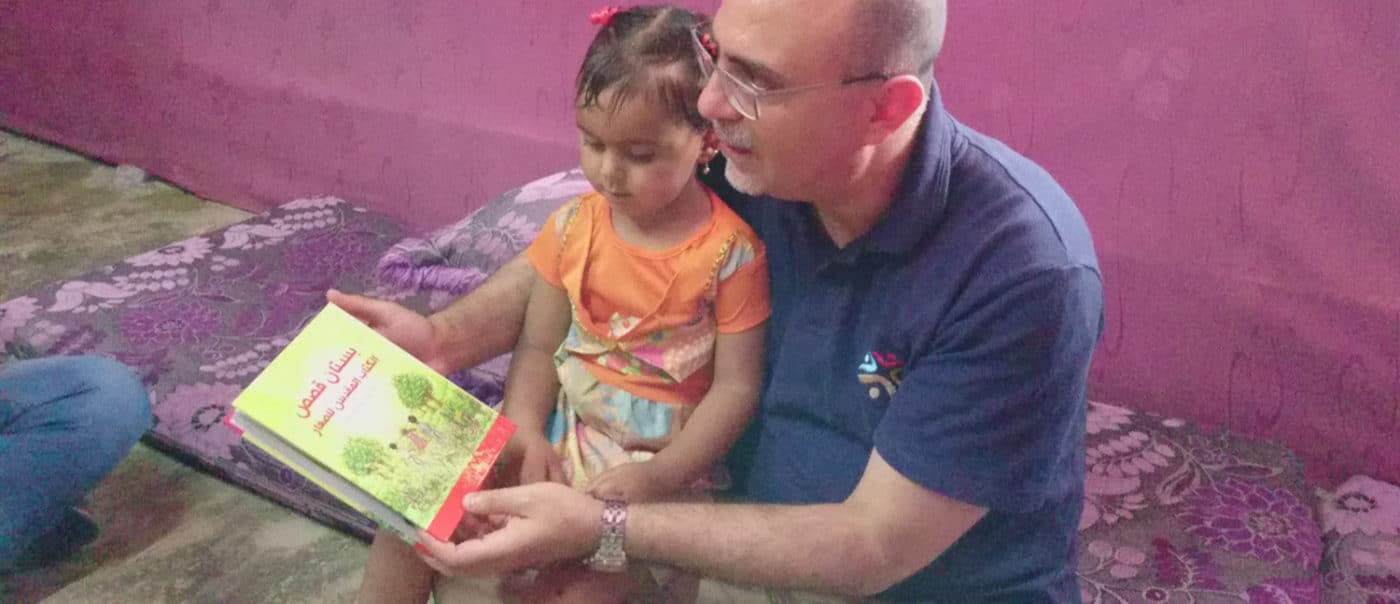 Lebanon Man Reading ACG To Kid